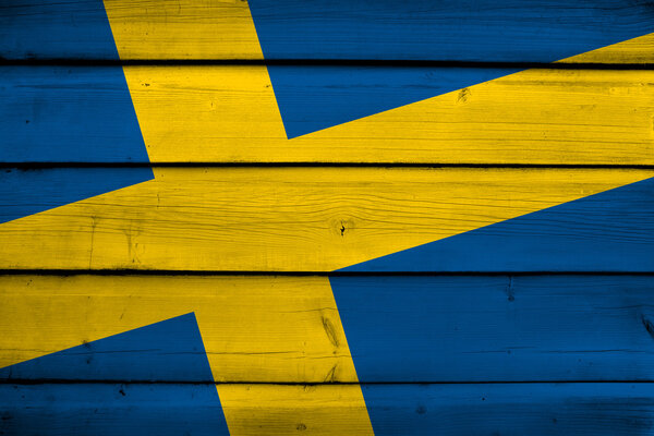 Флаг Швеции на деревянном фоне
