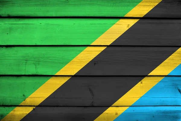 Bandera de Tanzania sobre fondo de madera — Foto de Stock