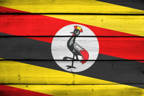 Uganda Flag on wood background — Stock Photo, Image