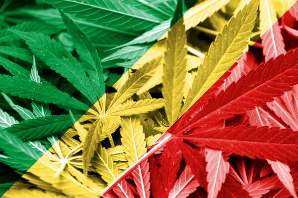 Congo Republic Flag on cannabis background. Drug policy. Legalization of marijuana
