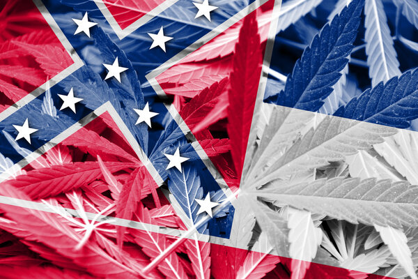 Mississippi State Flag on cannabis background. Drug policy. Legalization of marijuana