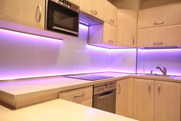 Modern luxury kitchen with pink LED lighting — Stock Photo, Image