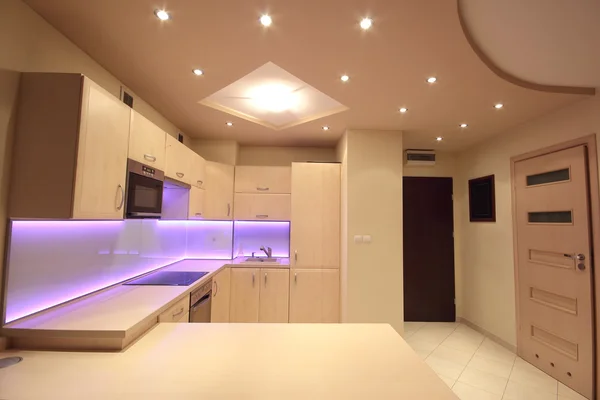 Modern luxury kitchen with pink LED lighting — Stock Photo, Image