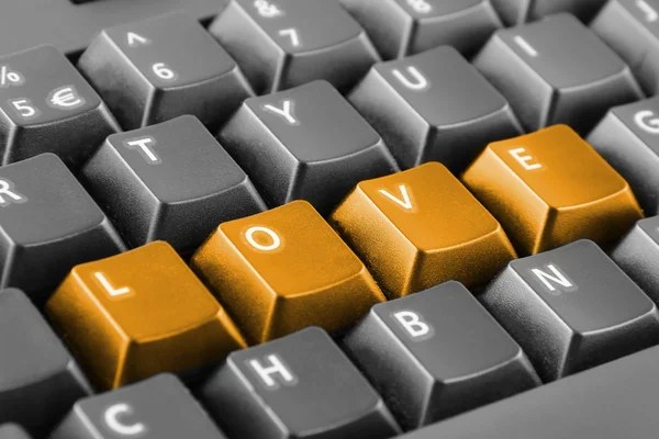 Wortliebe geschrieben mit Tastatur-Tasten — Stockfoto