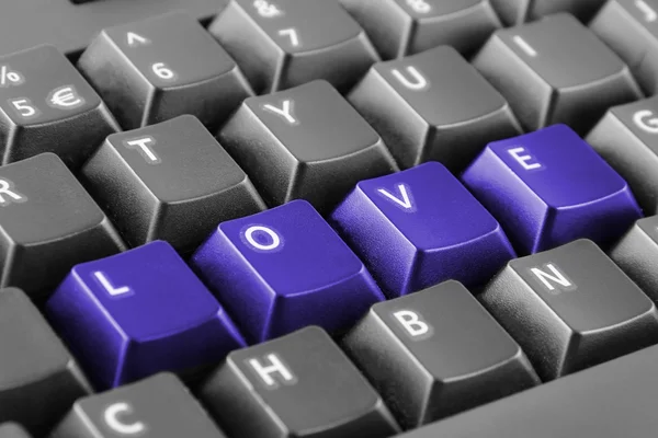 Słowo miłość napisane z przycisków klawiatury — Zdjęcie stockowe