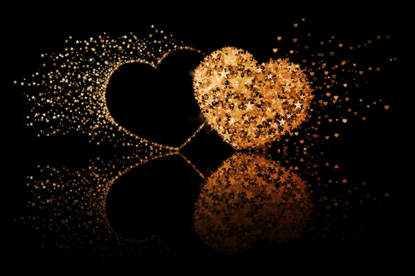 反射効果と黒の背景の 2 つの黄金の心 — ストック写真