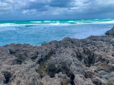 Rocks on the beach at Blowing Rock Preserve in Jupiter, Florida