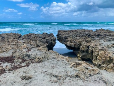 Rocks on the beach at Blowing Rock Preserve in Jupiter, Florida