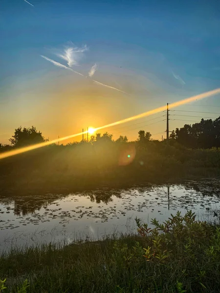 Colorful swamp sunset in Louisiana reflecting on American values.