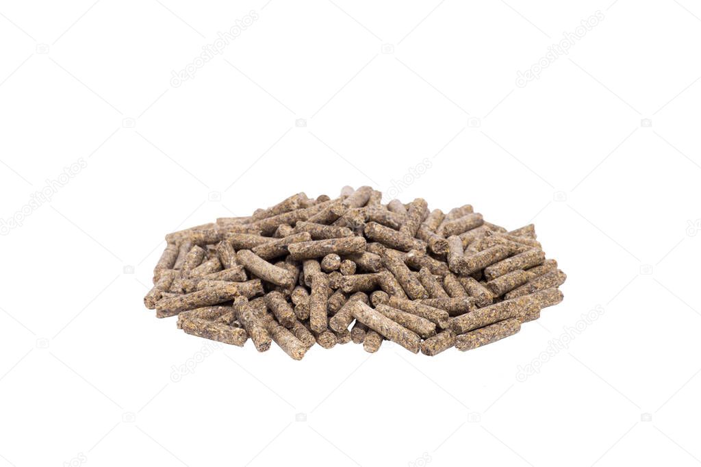 A pile of animal feed pellets isolated on a white background