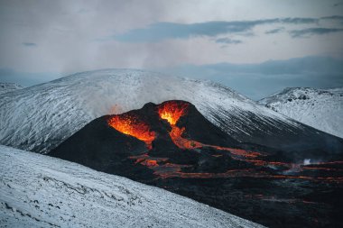 Iceland Volcanic eruption 2021. The volcano Fagradalsfjall is located in the valley Geldingadalir close to Grindavik and Reykjavik. Hot lava and magma coming out of the crater. clipart