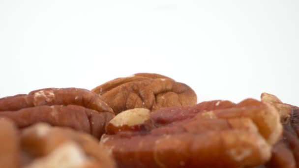 Super close-up, detailed, peeled pecan isolated on white background — Stock Video