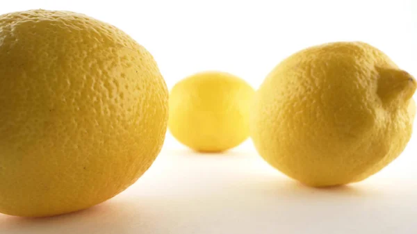 Extreme close-up, detailed . yellow ripe lemons isolated on white background — Stock Photo, Image