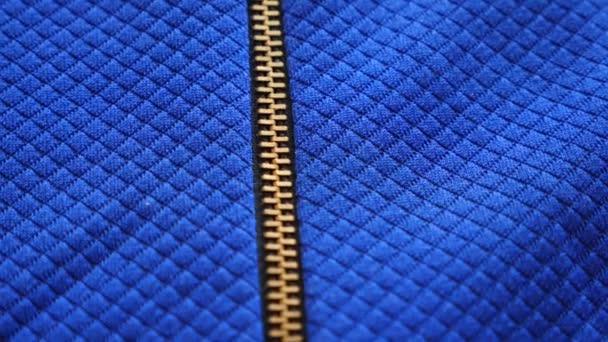 Fabric as background. 4k, slow motion, blue textured fabric, zip fastener — Stock Video