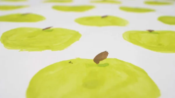 close-up. background of apples painted with watercolor on a sheet of paper