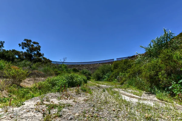 The Border Wall between the United States and Mexico from San Diego, California looking towards Tijuana, Mexico.