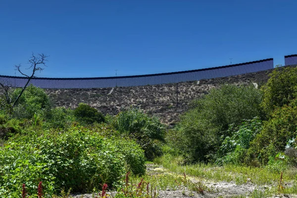 The Border Wall between the United States and Mexico from San Diego, California looking towards Tijuana, Mexico.