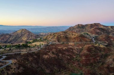 Panoramic view of the famous Mulholland highway in Southern California at sunset. clipart