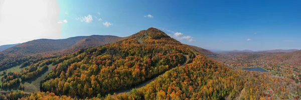 Colorful Hunter Ski Mountain in upstate New York during peak fall foliage.