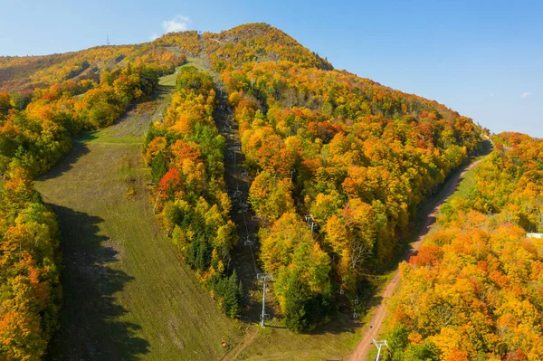 Colorful Hunter Ski Mountain in upstate New York during peak fall foliage.