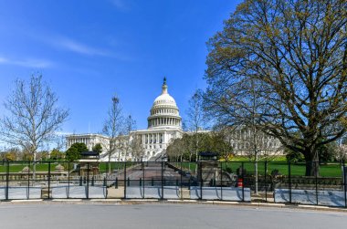 Washington, DC - Apr 3 2021: New security and fencing in place at the Nation's Capitol after the building was stormed by Trump-supporting rioters. clipart