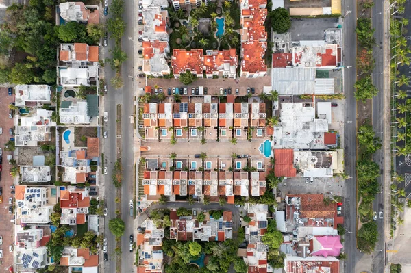Aerial top down view of houses and housing complexes in Cancun, Mexico.
