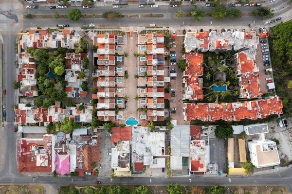 Aerial top down view of houses and housing complexes in Cancun, Mexico.