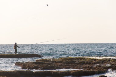 Adam Balık tutma - Caesarea, İsrail