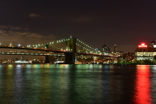 The view of the Brooklyn Bridge and the East River from the South Street Seaport in Manhattan, New York.