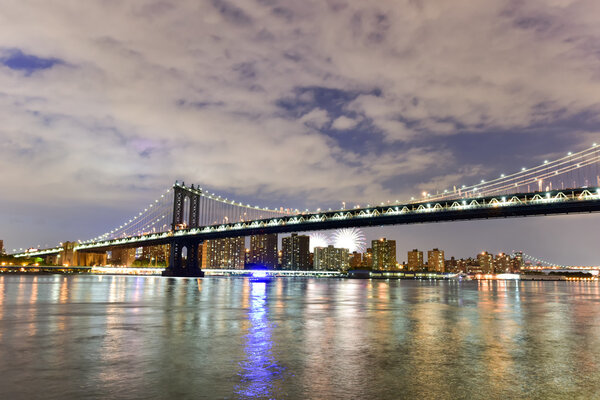View of the Brooklyn Bridge and Manhattan Bridge during Independence Day fireworks from Brooklyn Bridge Park, New York.