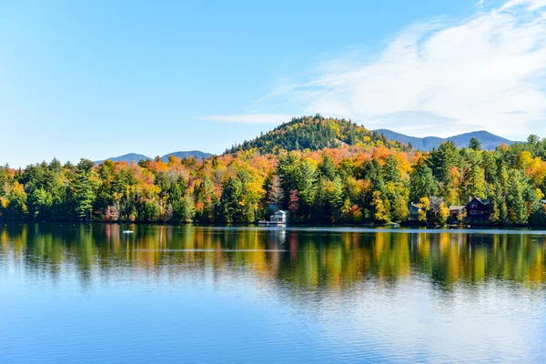 Farm in Upstate NY with Pond and Mountains in the Background Stock