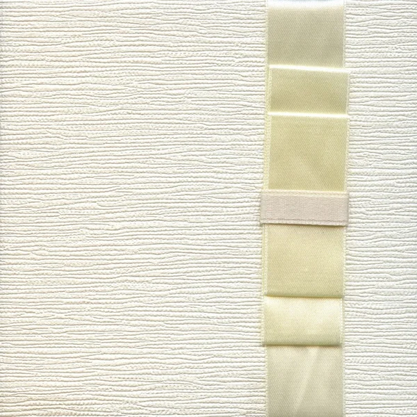 Background from white coarse canvas texture leather with ribbon