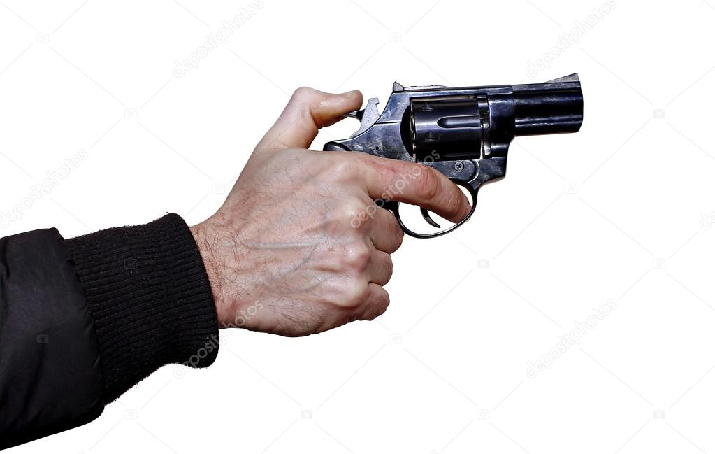 Black revolver in a male hand isolated