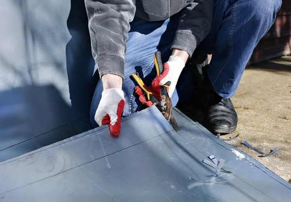 Worker on construction site cut stainless steel sheet shears of metal cutting — Stock Photo, Image