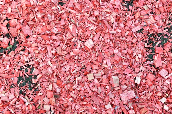 Hintergrund bemalter roter Hackschnitzel auf dem Boden — Stockfoto