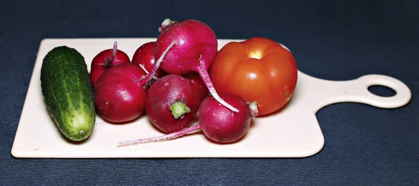 Fresh vegetables for salad on a cutting board — Stock Photo, Image