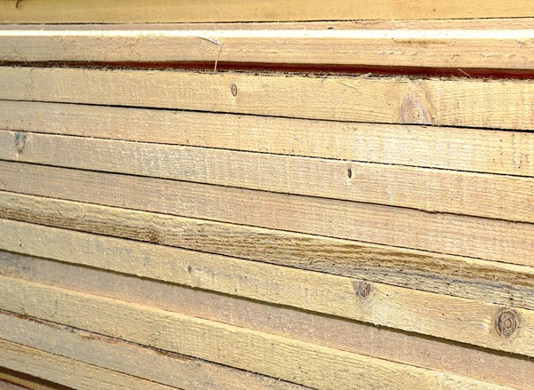 Unplaned thick planks impregnated with antiseptic — Stock Photo, Image