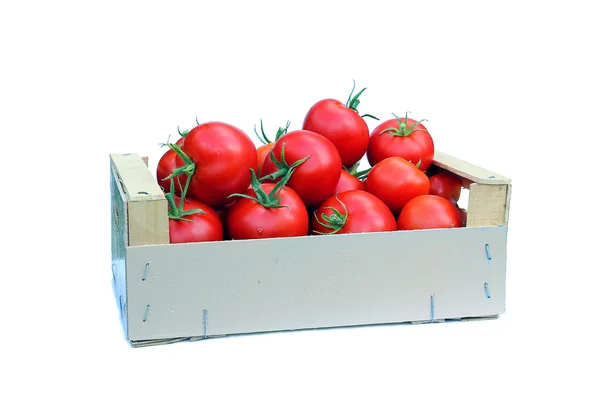 Tomates rojos en una caja de madera — Foto de Stock