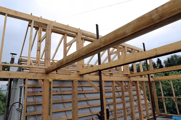 Installation of wooden beams at construction of the frame house — Stock Photo, Image