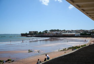 Paignton, United Kingdom - August 20 2020:  The view along Paignton beach to the Harbour on Eastern Esplanade clipart