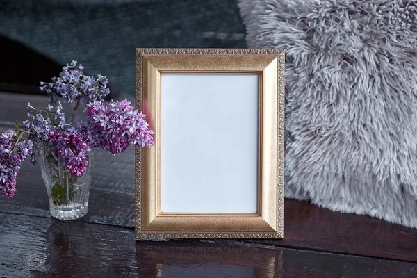 Elegant mock up frame with lilac flowers. Modern interior, minimalistic concept.
