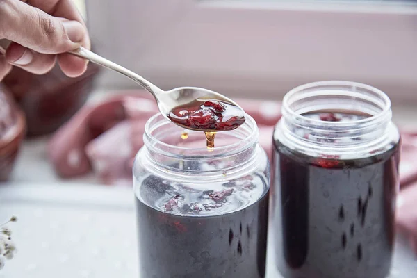 Healthy fermented honey product with cranberry. Food preservative at home, cozy, rustic flat lay. Delicious recipe concept. Anti-viral food.