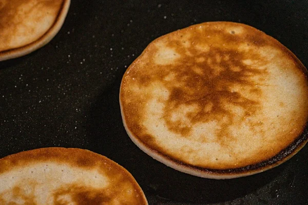 closeup of delicious pancakes fried in oil in a pan