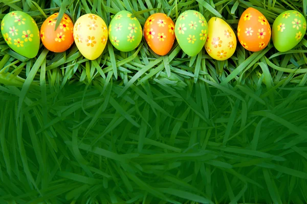 Pattern Easter eggs on the grass — Stock Photo, Image