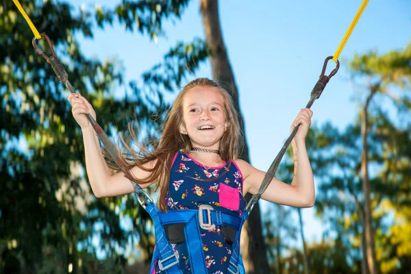 Girl jumping on a trampoline