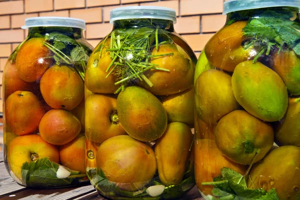 Tomatoes in jars Stock Photo