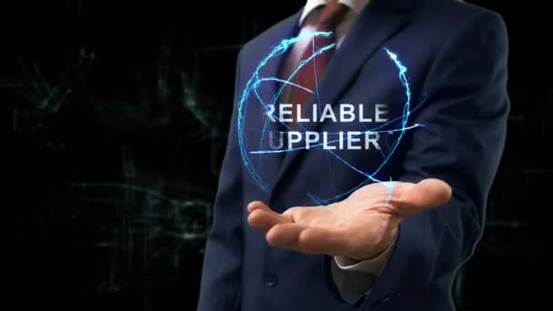 Businessman shows concept hologram Reliable Suppliers — Stock Video