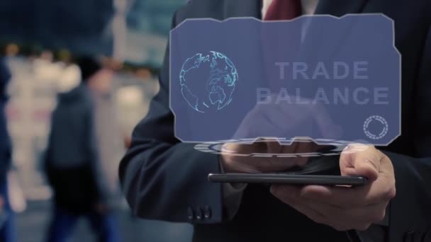 Empresário usa holograma Balança Comercial — Vídeo de Stock