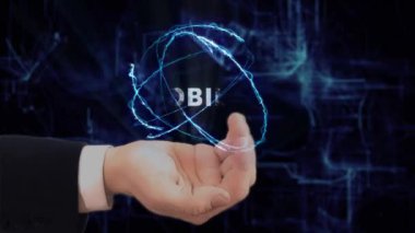 Boyalı el cep telefonunu gösterir
