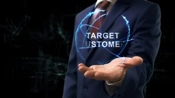 Businessman shows concept hologram Target Customer — Stock Video